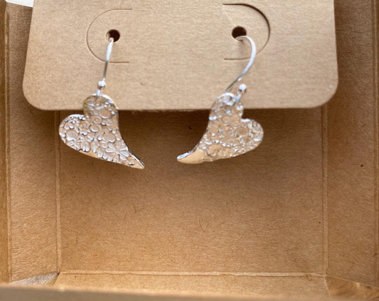 Fine silver flower print heart drop earrings, handmade in Gloucestershire, UK.